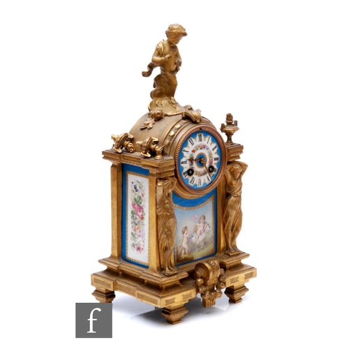 390 - A 19th Century French gilt mantle clock, surmounted with a cherub over Sevres style panels and dial ... 