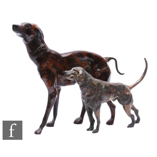 399 - A late 20th Century bronze study of a standing lurcher or pointer, height 36cm, and a similar dog wi... 