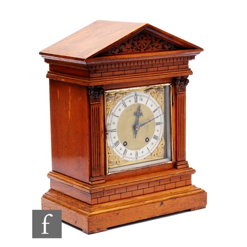 400 - A late 19th Century bracket clock with architectural style oak case, the brass dial with silvered ch... 