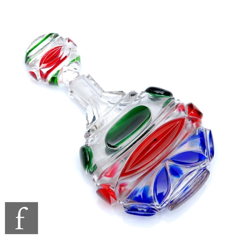 617 - An early 19th Century Bohemian crystal scent bottle, the compressed circular body cased in blue, red... 