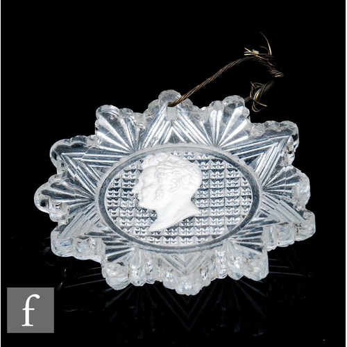 618 - A 19th Century clear crystal portrait medallion of star shape, internally decorated with a profile s... 