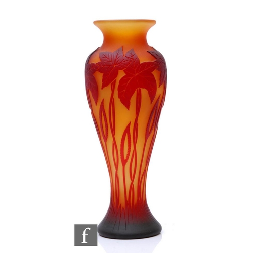 792 - A large contemporary studio cameo glass vase by Richard P. Golding for Okra, the slender baluster fo... 