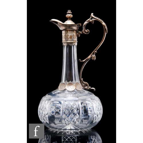 891 - A late 19th Century clear cut crystal claret jug of globe and shaft form with white metal mounts of ... 