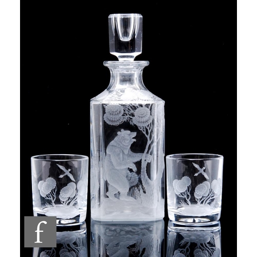 898 - A 20th Century French clear crystal decanter, of square section with later engraving depicting a bea... 