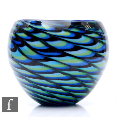 905 - A contemporary studio glass bowl, internally decorated with fish scale design in blue black and gree... 