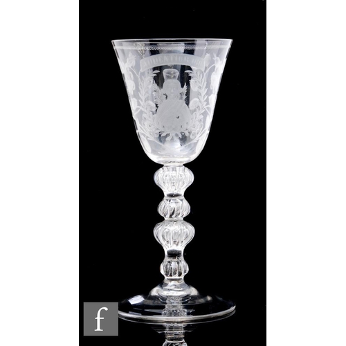 911 - A 20th Century copy of a clear crystal Jacobite goblet, the round funnel bowl engraved with Jacobite... 