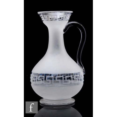 915 - A 19th Century clear crystal glass water or claret jug in the manner of Richardsons, the footed ovoi... 