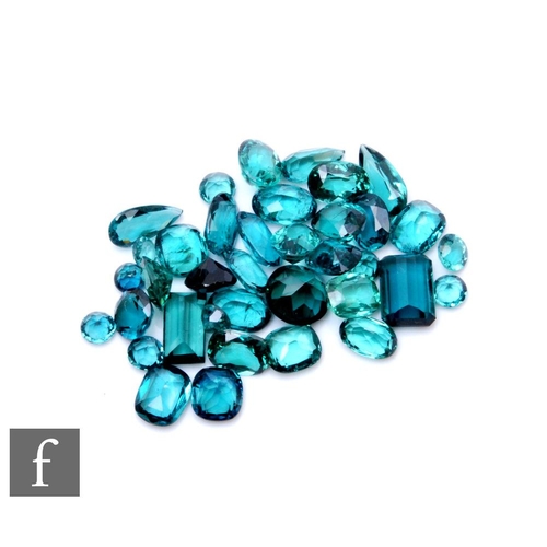 103 - A small parcel lot of loose cut and polished blue tourmaline stones to include oval, marquise and em... 