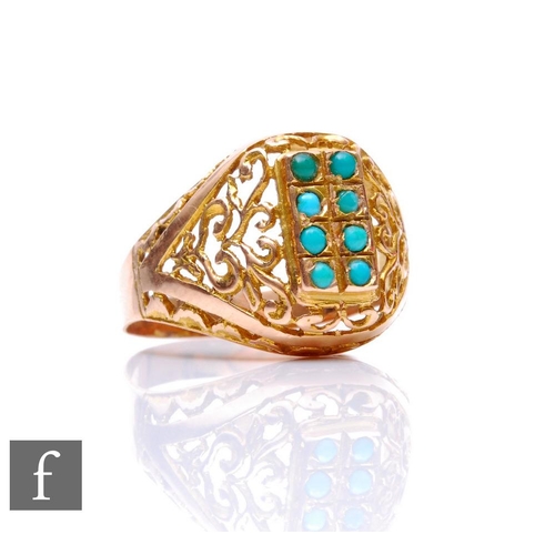 158 - A 14ct turquoise set ring comprising two rows of four vertically set stones to pierced shoulders, we... 