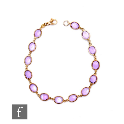 19 - An 18ct hallmarked amethyst bracelet comprising fourteen oval individually set collar set stones, we... 