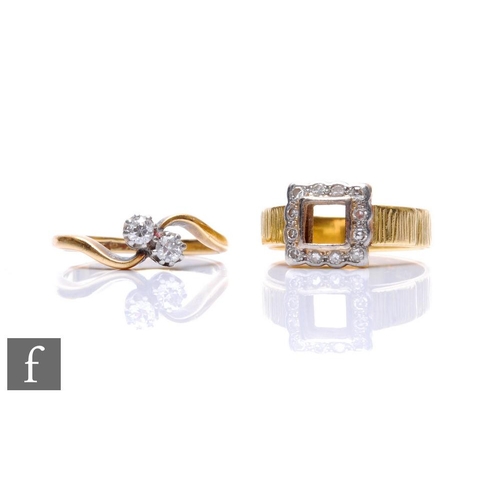 77 - Two 18ct rings to include a diamond two stone cross over and a ring with a diamond border to a vacan... 