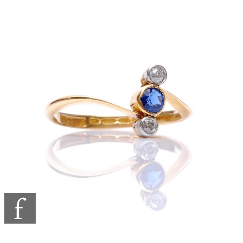 86 - An early 20th Century 18ct hallmarked sapphire and diamond three stone ring, central sapphire flanke... 