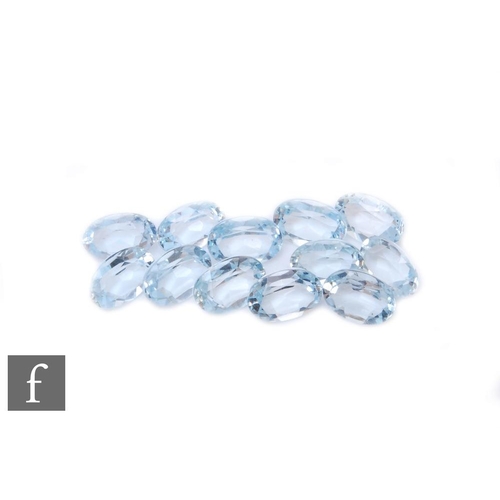 99 - Twelve loose cut and polished oval faceted aquamarine stones, each approximately length 7mm x width ... 