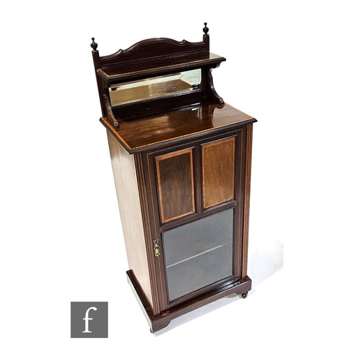 1008 - An Edwardian Sheraton Revival line-inlaid mahogany side cabinet, the upright pediment with bevel mir... 