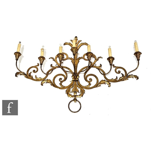 974 - An early 20th Century seven gilt branch wall sconce, 72cm x 104cm.