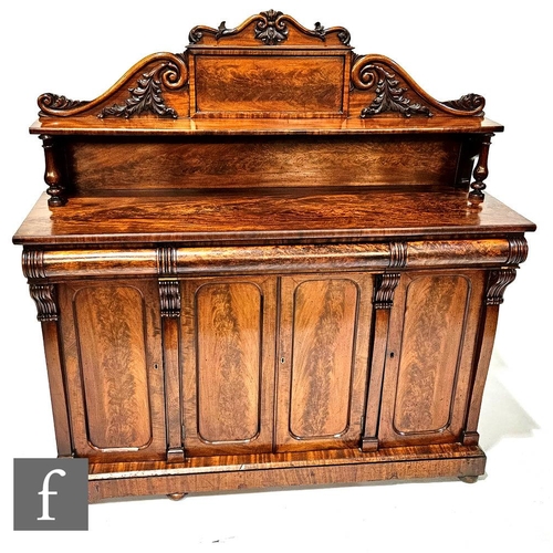 1003 - A Victorian mahogany chiffonier with acanthus carved upright pediment over three frieze drawers and ... 