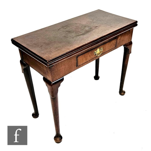 1013 - A George III mahogany rectangular fold over tea table fitted with a single drawer on lappit carved s... 