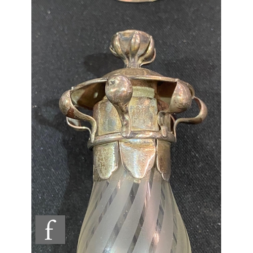 231 - A hallmarked silver and glass Arts & Crafts scent bottle, circular silver base supporting a part... 