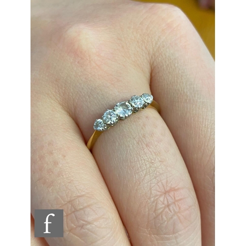 33 - A mid 20th Century 18ct graduated diamond five stone ring, claw set stones, centre stone approximate... 