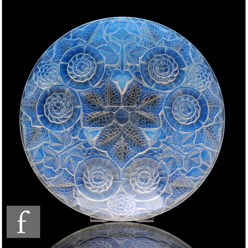 812 - A 1930s French Art Deco pressed glass bowl of shallow circular form, relief moulded to the exterior ... 