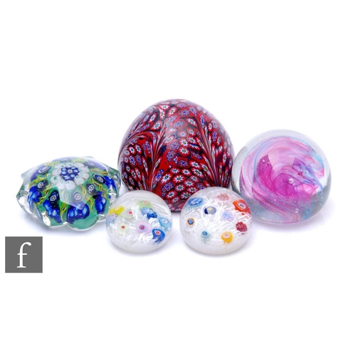 816 - A small group of 20th Century paperweights to include an Italian example with external millefiori ca... 