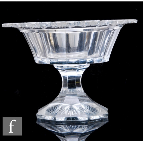 822 - A large early 19th Century Anglo-Irish clear cut crystal table centre bowl with a cut roll rim above... 