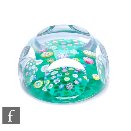 837 - A 20th Century Whitefriars crystal glass paperweight, the pale translucent green canopy spotted with... 