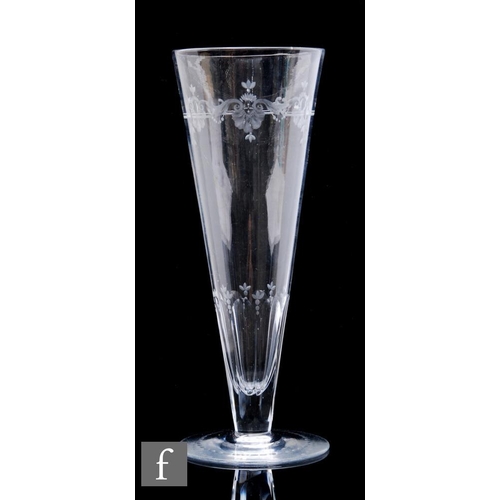 851 - A Victorian clear crystal glass vase, of elongated conical form with engraved floral and scroll bord... 