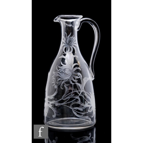 860 - A 20th Century clear crystal glass jug, of shouldered ovoid form with tapered neck and applied loop ... 