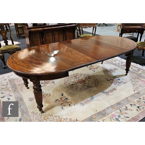 1005 - A 19th Century mahogany extending D-end dining table complete with single insert leaf, raised to tap... 