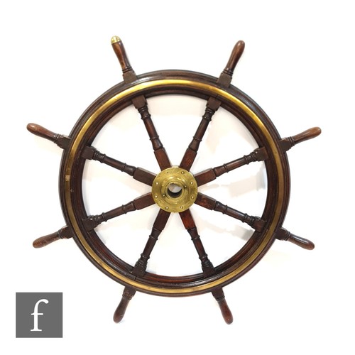 362 - A large 19th Century mahogany and brass ships wheel with central fixed boss and eight radiating spin... 