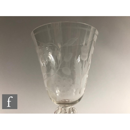 911 - A 20th Century copy of a clear crystal Jacobite goblet, the round funnel bowl engraved with Jacobite... 