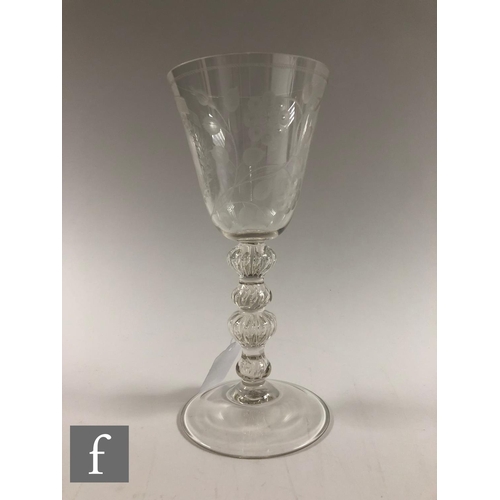 911 - A 20th Century copy of a clear crystal Jacobite goblet, the round funnel bowl engraved with Jacobite... 