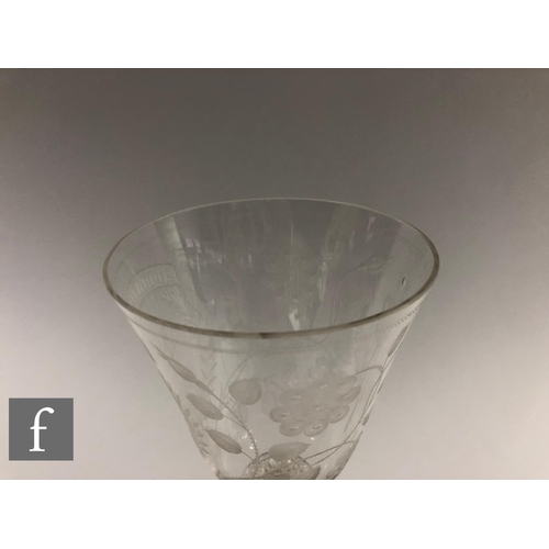 911 - A 20th Century copy of a clear crystal Jacobite goblet, the round funnel bowl engraved with Jacobite... 