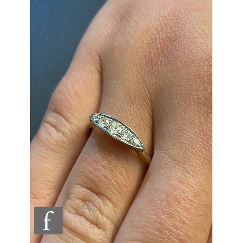 84 - An early 20th Century 18ct diamond five stone boat shaped ring, old cut stones to an elliptical shap... 