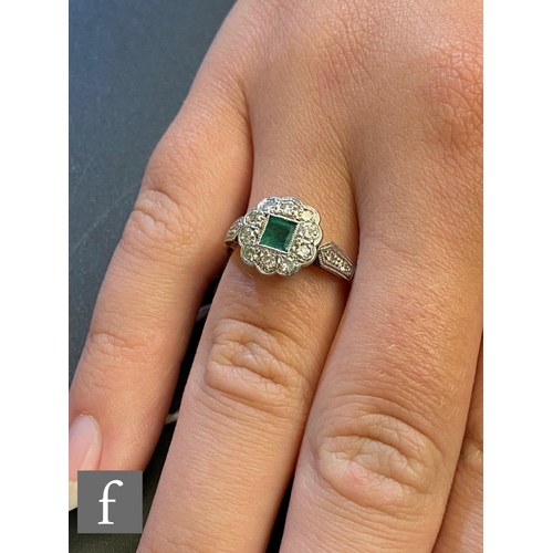 88 - A mid 20th Century 18ct emerald and diamond cluster ring, central square cut emerald, length 3.8mm, ... 