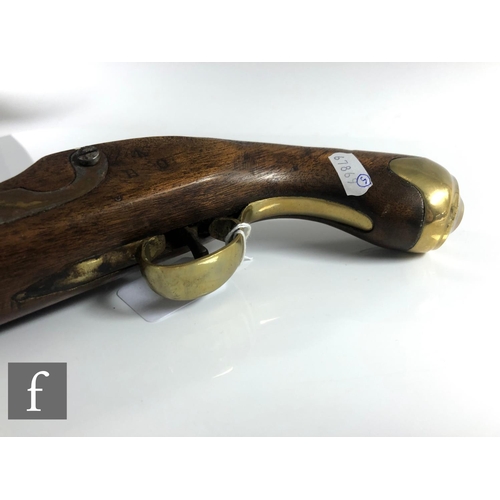 432 - A 19th Century flintlock holster pistol, 21cm barrel, tower mark, brass trigger guard and butt.