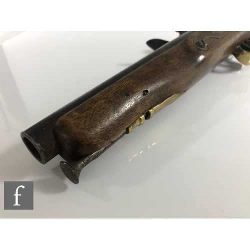 432 - A 19th Century flintlock holster pistol, 21cm barrel, tower mark, brass trigger guard and butt.