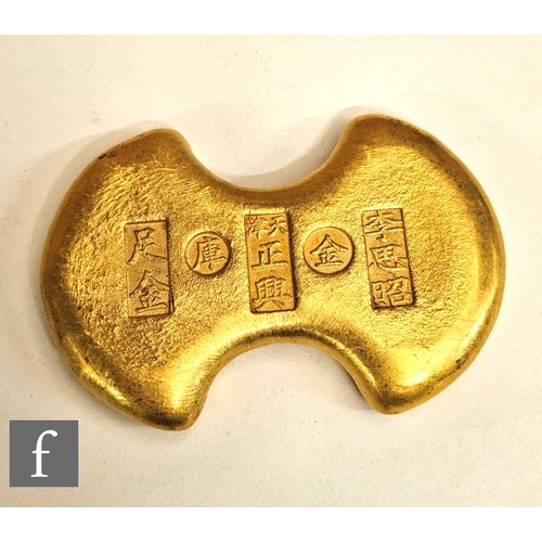 9076 - A Chinese gold coloured ingot/coin.NB - Tested not gold