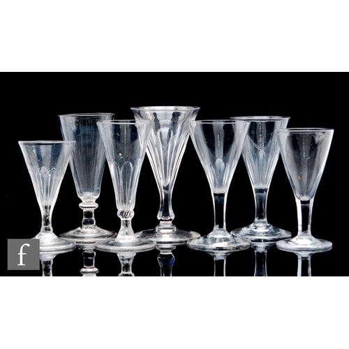 9111 - A collection of assorted 19th Century drinking glasses to include slice cut, petal molded and plain ... 