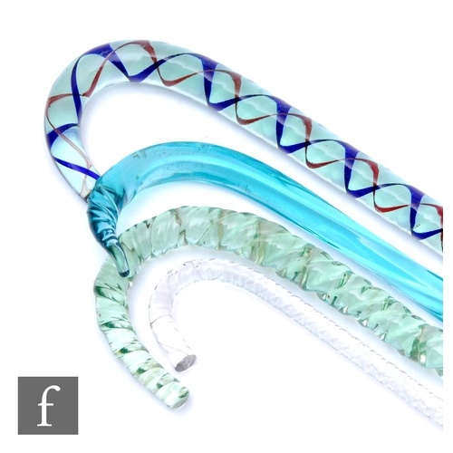 9113 - A collection of 19th Century glass frigger walking sticks to include clear twist, green twist and a ... 