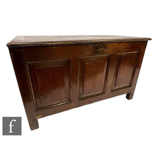 1089 - An 18th Century oak coffer chest, with triple fielded front panel above stile feet, height 64cm, wid... 