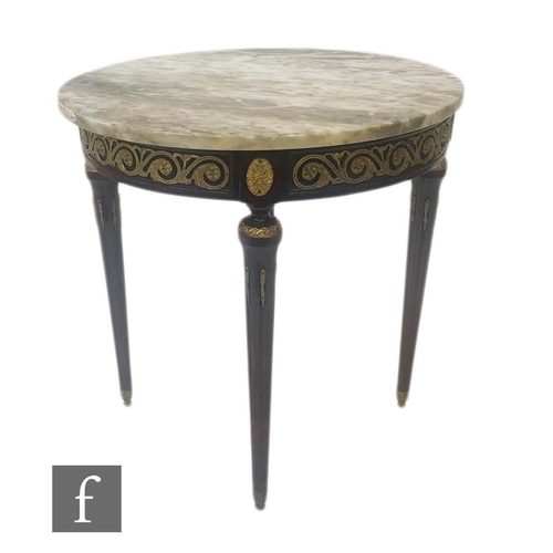 1095 - A late 20th Century marble top occasional table in the French Empire style, the circular top above a... 