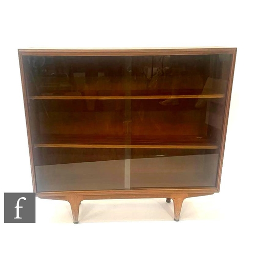 1108 - A mid 20th Century teak bookcase, with sliding glazed double doors over tapered legs, height 89cm, w... 