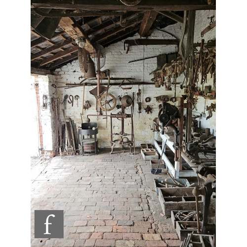 1115 - The contents of an entire working Victorian forge to include a large pair of hand operated studded l... 