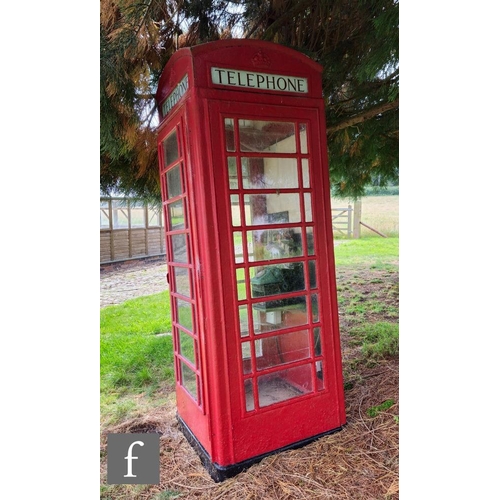 1117 - A 1950s K6 red cast iron telephone box, the domed top over four sides with glass panels named 'Telep... 