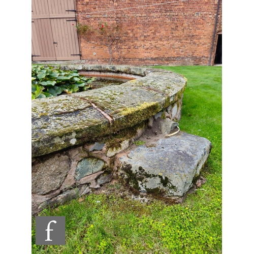 1122 - Twenty five 19th Century sandstone circular coping stones used to form the border of a garden pond, ... 