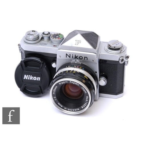 131 - A 1963 Nikon F SLR camera, serial No.6522850, black and chrome body, with a Nikkor-H Auto 1:2 f=50mm... 