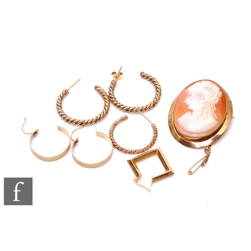 654 - A 9ct hallmarked mounted cameo brooch, weight 9g, with two pair of 9ct hoop earrings and two 9ct odd... 