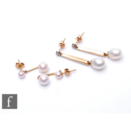 657 - A pair of 9ct hallmarked cultured pearl and diamond drop earrings, length of drop 3.5cm, with a simi... 